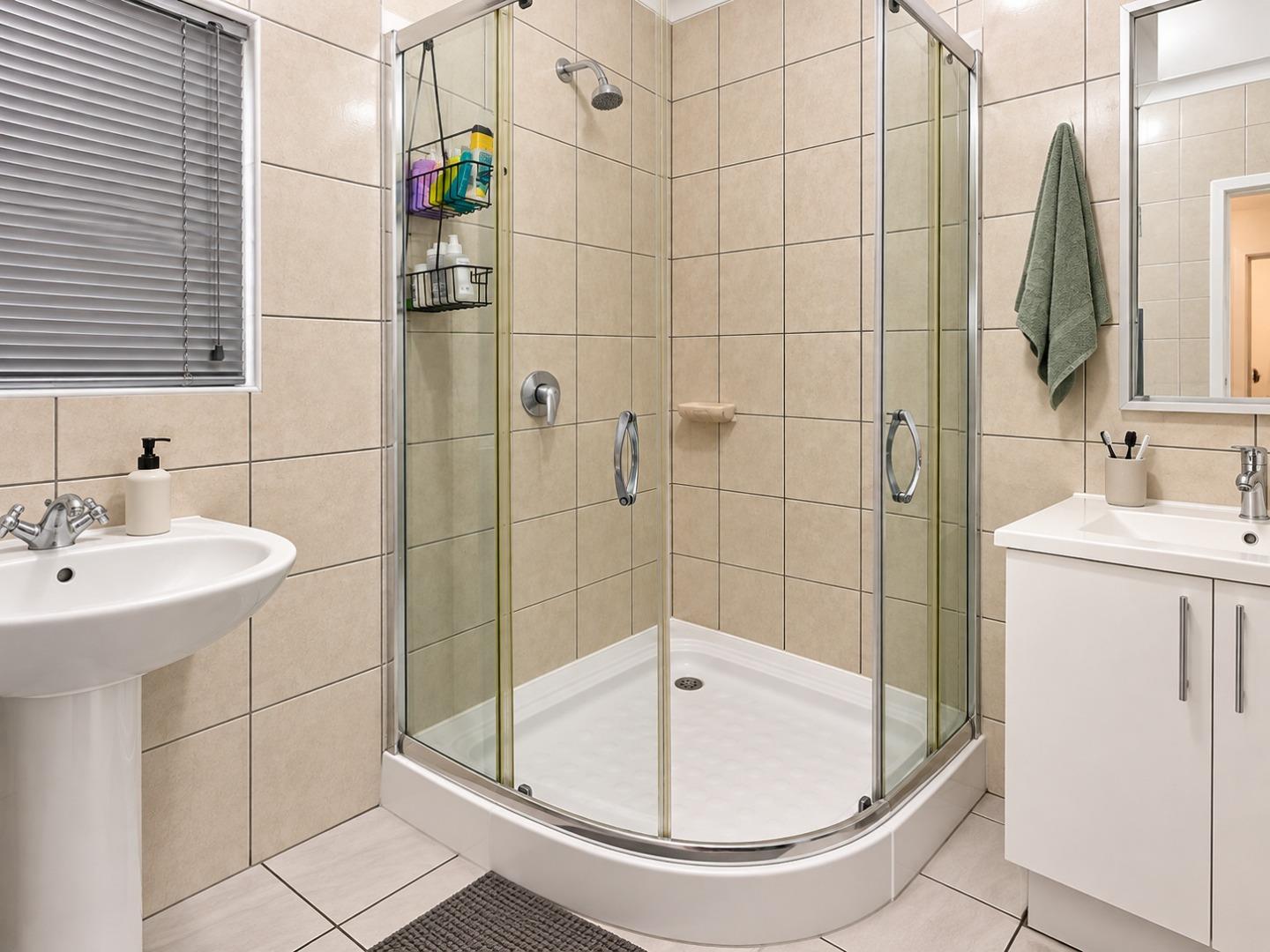 769370_Modern_Beige-Tiled_Bathroom_with_Corner_Shower.jpg