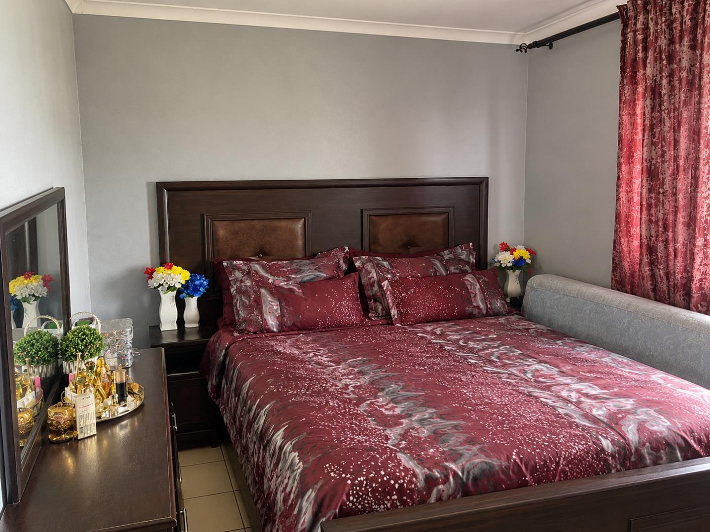 769714_Elegant_Burgundy_Bedroom_Interior.jpg